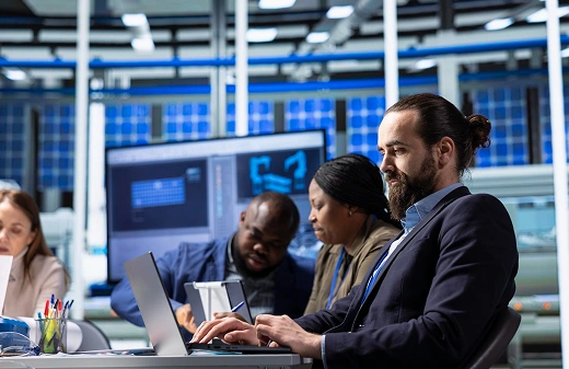 IT team working on laptops